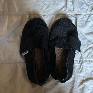 Tom’s black glitter shoes